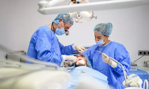 dental-surgeon-and-assistant-work-putting-dental-i-2026-01-05-01-03-28-utc